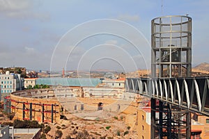 Ruins of ancient arena and modern elevator. Cartagena, Spain photo